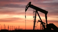Oil jumps three percent as dollar falls, U.S. rig count drops
